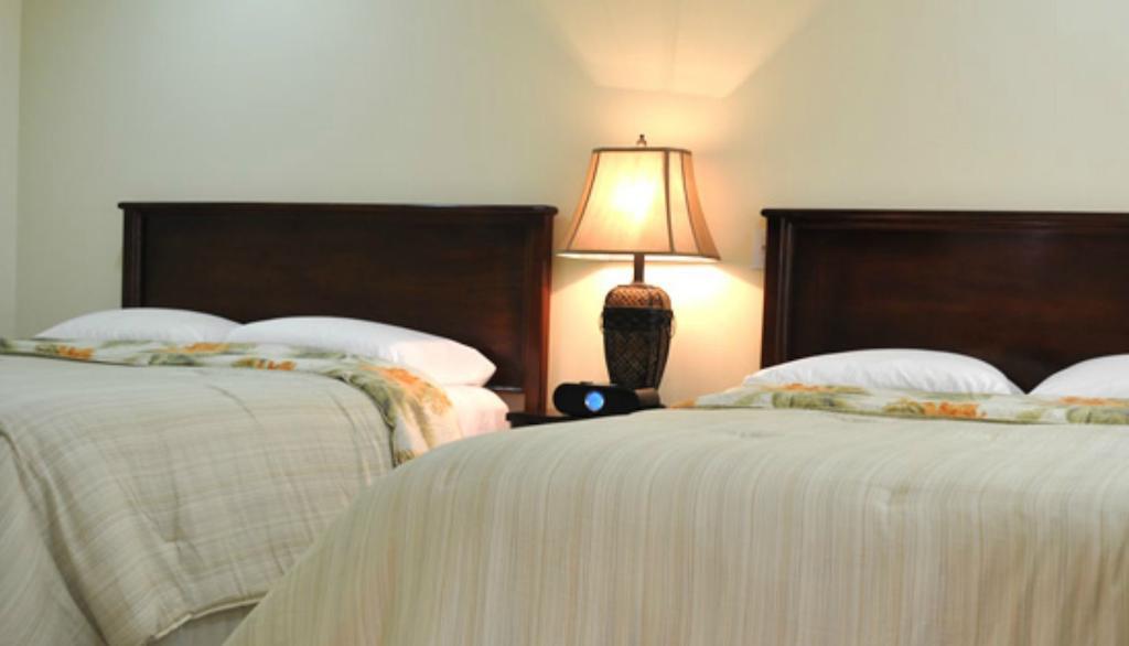 Rainbow Hotel Caye Caulker Rom bilde